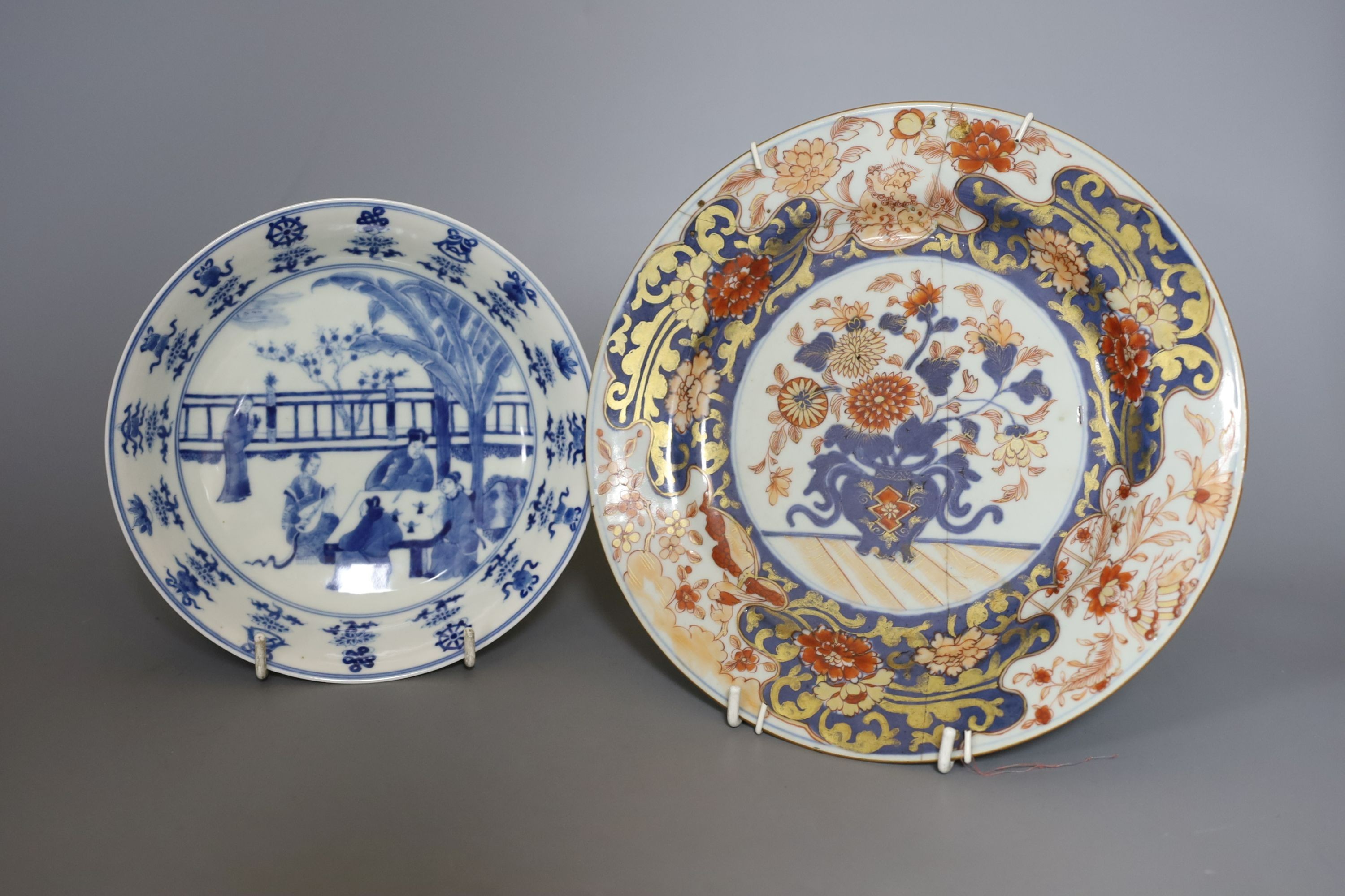 Three Chinese plates including a 19th century Chinese Imari dish, 23cm - repaired, a Chinese famille rose crackleglaze vase, 29cm, together with a famille rose teapot and a crackleglaze celadon ground bottle vase. Talles